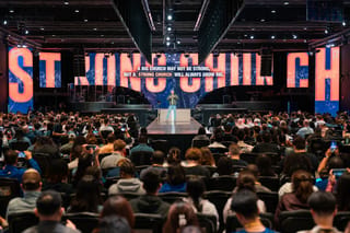 Pastor How addressing the congregation at a Heart of God Church StronG Church session