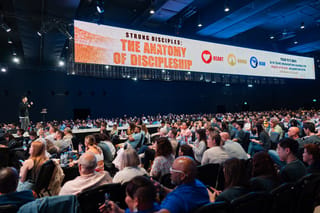 Conference screen displaying the 'StronG Disciples: The Anatomy of Discipleship' teaching session
